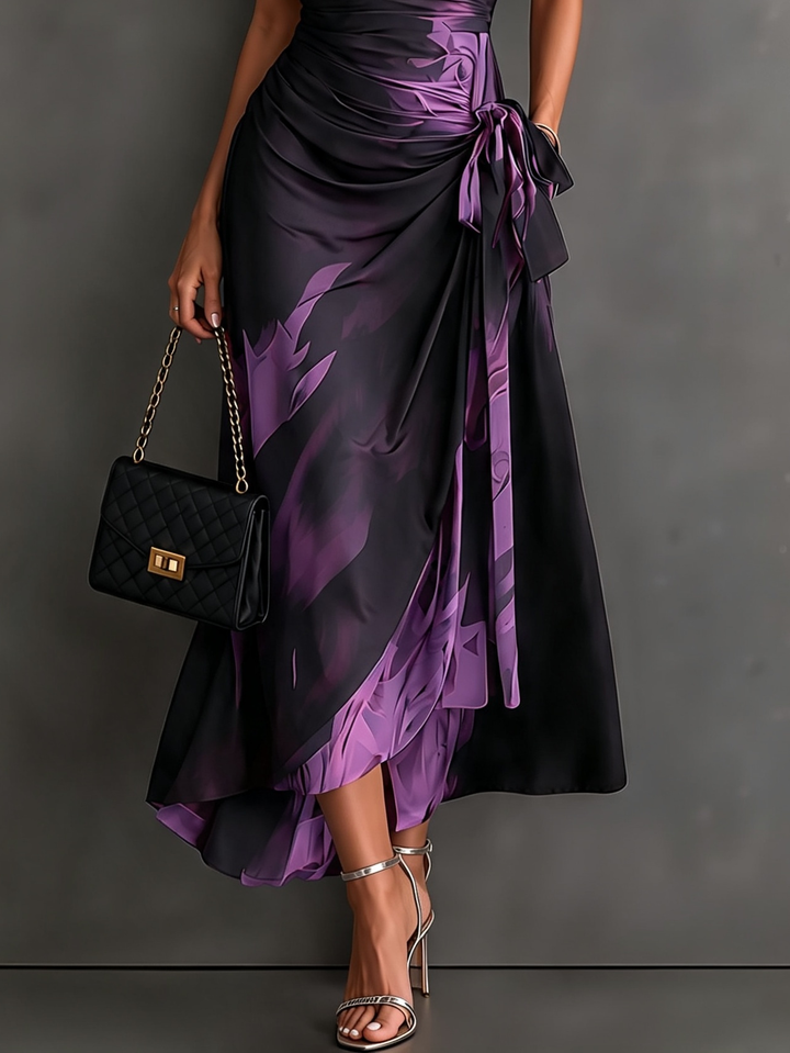 Maddie | Midi wrap dress with abstract red-black print, V-neck, short sleeves, tie belt, and asymmetrical ruffle hem