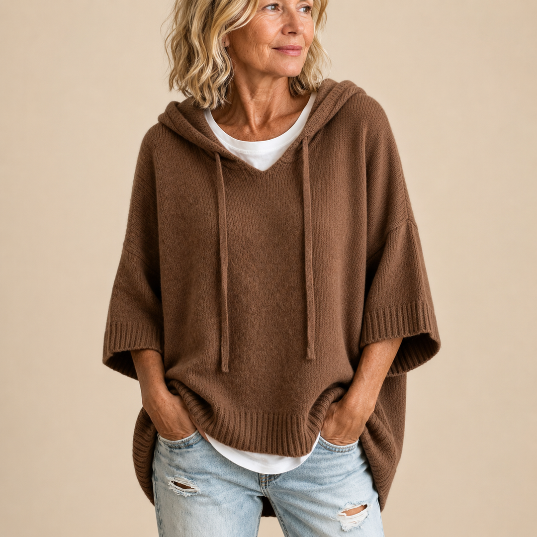 Orielle | Poncho-style knitted sweater with hood and three-quarter sleeves.