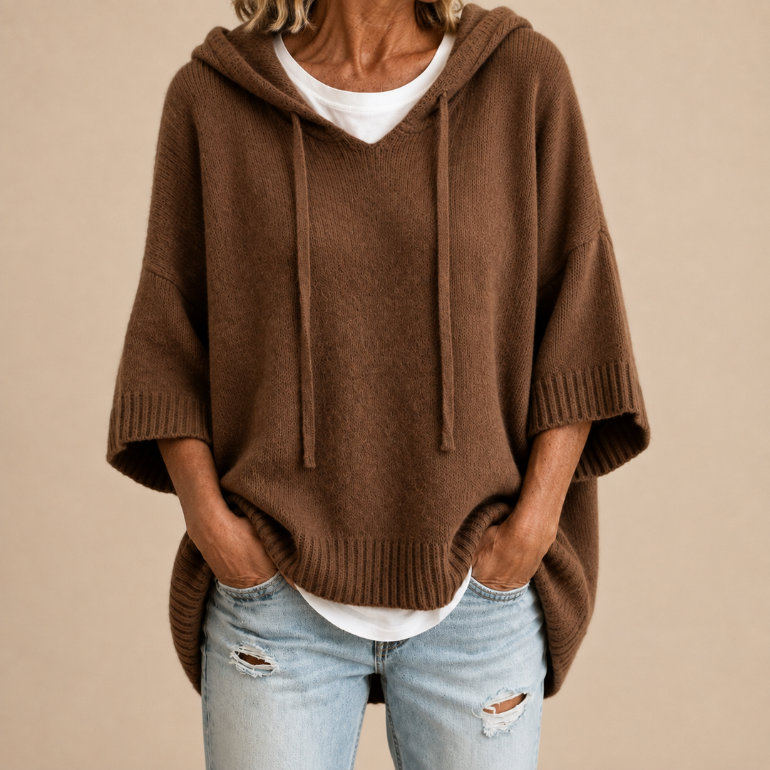 Orielle | Poncho-style knitted sweater with hood and three-quarter sleeves.