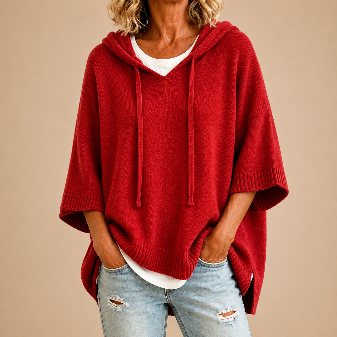 Orielle | Poncho-style knitted sweater with hood and three-quarter sleeves.