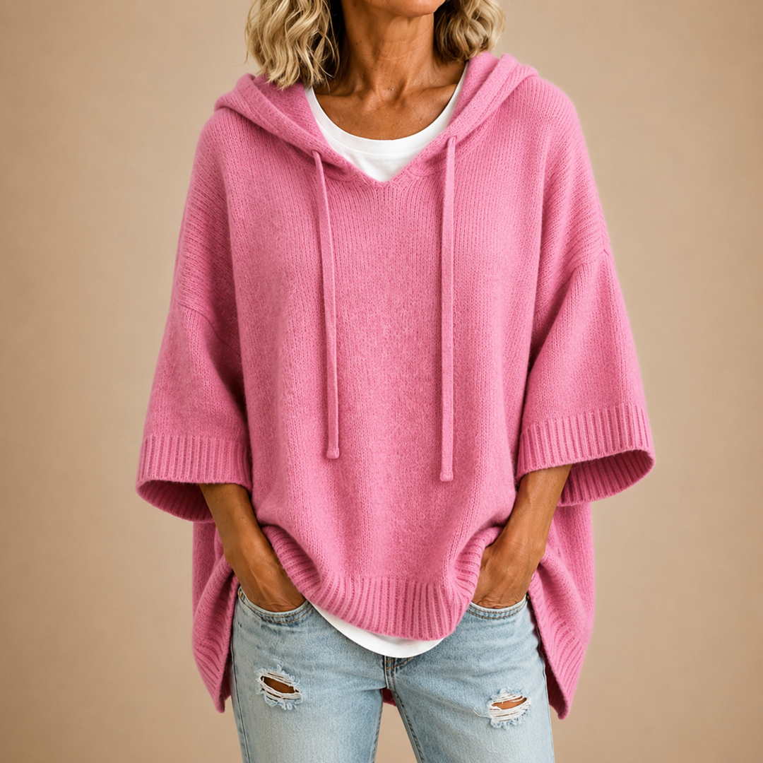 Orielle | Poncho-style knitted sweater with hood and three-quarter sleeves.