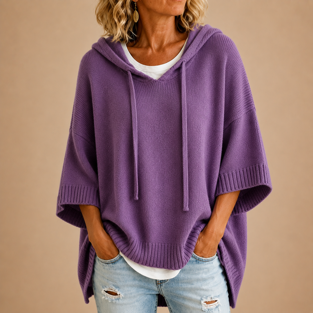 Orielle | Poncho-style knitted sweater with hood and three-quarter sleeves.