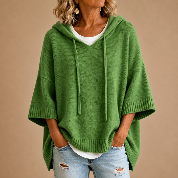 Orielle | Poncho-style knitted sweater with hood and three-quarter sleeves.